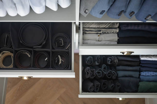istock Man cupboard clothes storage organization neatly folded belt underwear shirt and socks 1753459170