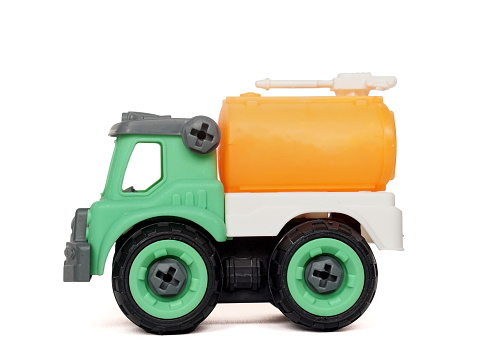 side view plastic towing truck toy isolated on white background, DIY assemble toy for increasing kid's creativity.