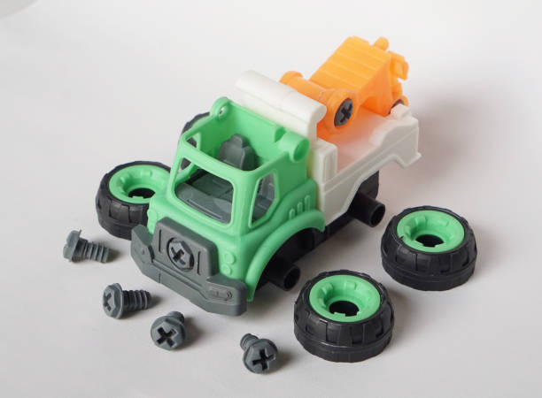 istock DIY plastic towing truck toy isolated on white background with bolt and nut 1753471141