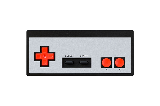 Wireless rectangular retro game controller with red buttons, isolated on white background.