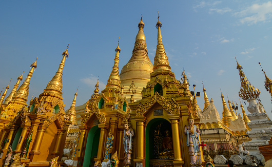 Part of Shwedagon Pagoda at sunny day in Yangon, Myanmar. The Pagoda is believed by Buddhists to be around 2500 years old.