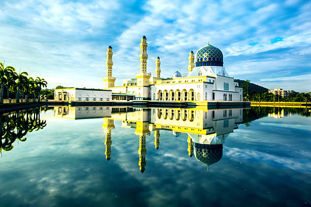 mosque covered blue cloud stock photo