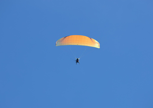 Paragliders are practicing flying in the blue sky, An Giang province, Mekong Delta