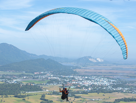 Flying with powered paraglider over Apuan Alps, Italy