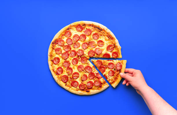 istock Homemade pizza pepperoni isolated on a blue background 1753508502