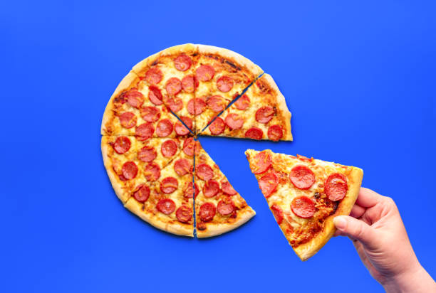 istock Homemade pepperoni pizza slice on a blue table 1753508503