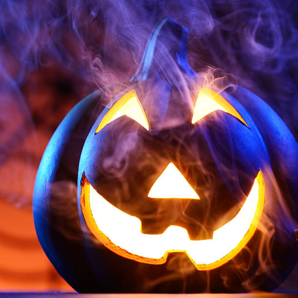 istock Halloween pumpkin in dark blue with spider web and smoke 175352617