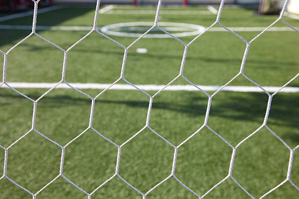 istock white football net, green grass ,futsal goal 175353339