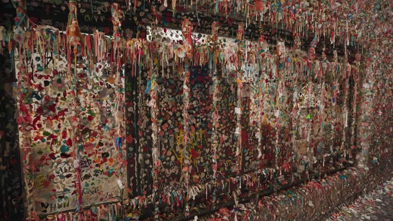 The Gum Wall - a Brick Wall Covered in Used Chewing Gum under Pike Place Market in Downtown Seattle, Washington, United States