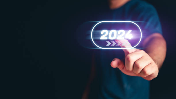 istock Man hand touching the 2024 abstract cyberpunk technology interface by pointing finger on isolated black background with copy space. Happy New Year 2023 to 2024 concept. Innovation and hitech theme. 1753559315