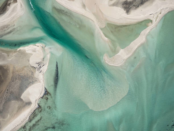 istock Aerial view of sand and water patterns 1753562358
