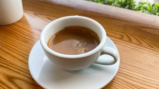 istock Hot espresso on a wooden table 1753565124