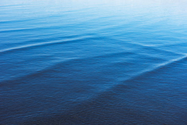 High angle view of seawater surface texture background of the shallow sea.