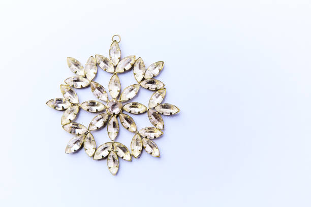 Christmas ornament on bright paper background. Top view. Close up. Copy space.