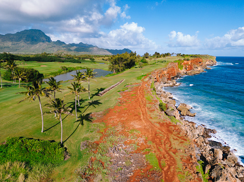 Aerial view of Mahaulepu trail running by coastline on Kauai Hawaii USA