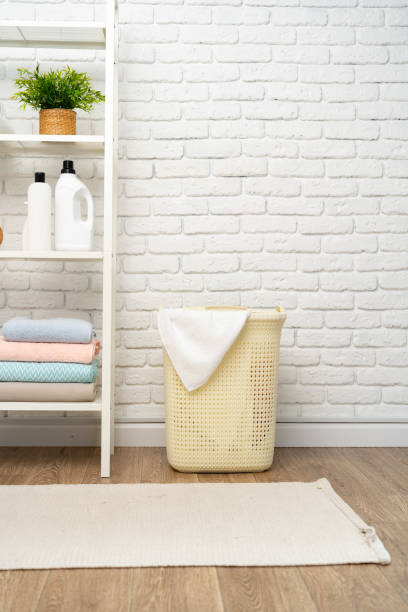 istock Beige plastic basket for laundry in a room 1753592713