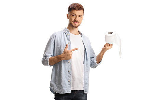 Guy pointing at a toilet paper roll isolated on white background