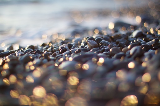 The reflection from the sea waves and stones