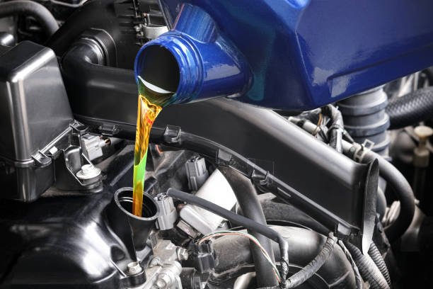 istock Refueling and pouring oil quality into the engine motor car Transmission and Maintenance Gear.Energy fuel concept 1753601454