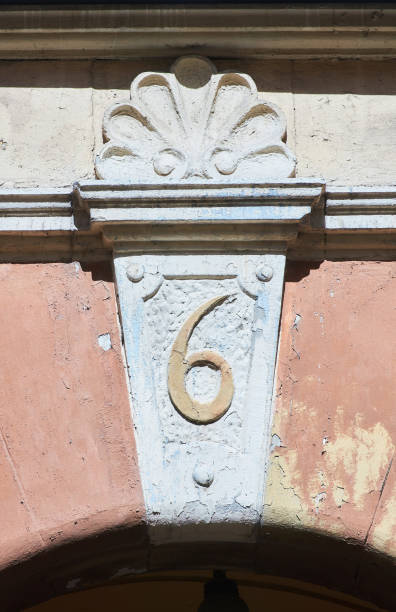 istock Bas-relief with the house number on an old building. Architectural details. 1753609703