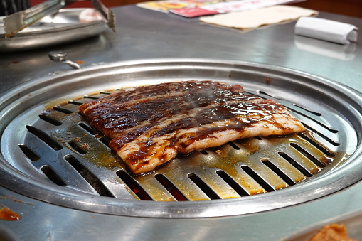 Raw beef and pork slice on grille for barbecue or Korea style