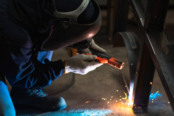 istock Skillful welders weld stainless steel in the factory 1753664838