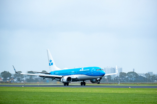 KLM Boeing 737-800 airplane landing at Schiphol airport on the Polderbaan. KLM Royal Dutch Airlines (Koninklijke Luchtvaart Maatschappij) part of Air France–KLM has its home base at Schiphol Amsterdam airport.