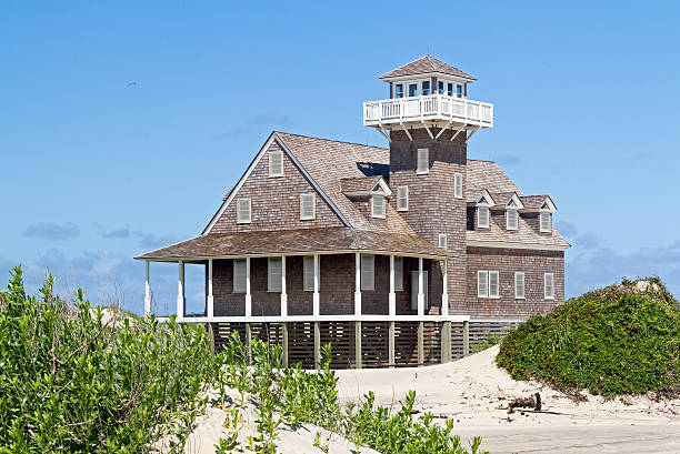 Oregon Inlet Life Saving Station The restored Oregon Inlet Life Saving Station stands on the North Carolina Outer Banks coast at Pea Island National Wildlife Refuge in Cape Hatteras National Seashore. bodie island stock pictures, royalty-free photos & images