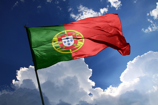 3d illustration flag of Portugal. Portugal flag isolated on the blue sky with clipping path.