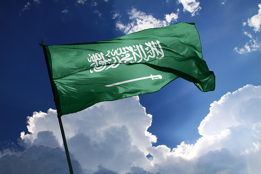 3d illustration flag of Saudi Arabia. Saudi Arabia flag isolated on the blue sky with clipping path.