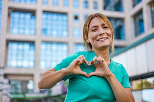 istock Home caregiver making a heart shape with her hands 1753687033
