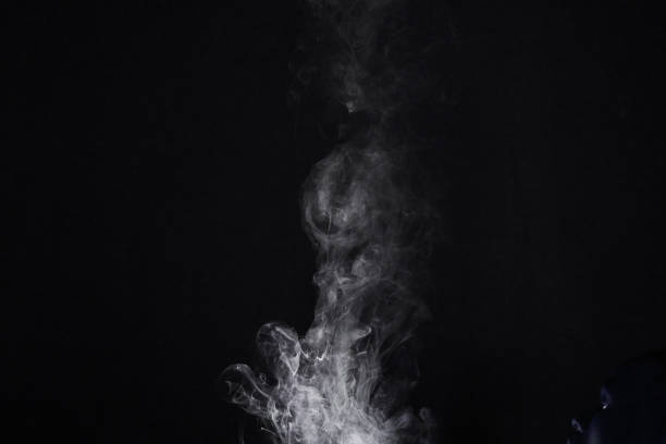 istock Smoke, vapor or gas in a studio with dark background by mockup space for magic effect with abstract. Incense, steam or fog mist moving in air for cloud smog pattern by black backdrop with mock up. 1753688125