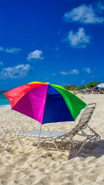 istock A colorful beach umbrella with caribbean sea background 1753702243