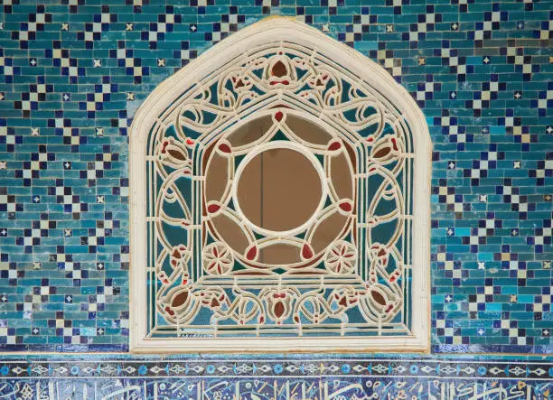 Photo of Miniature window for lighting rooms. An ancient oriental palace.