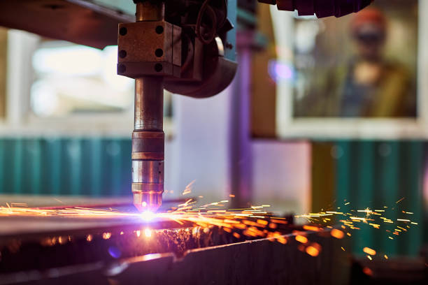 istock CNC laser plasma. Selective focus on modern technology laser plasma cutting of metal in process at metalworking factory male worker on background copyspace 1753712025