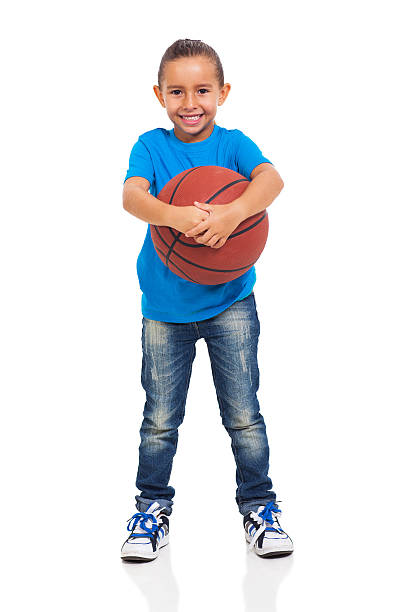 istock little girl holding a basket ball 175372720