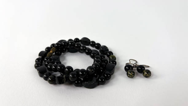 istock Semi-precious stone necklace and earrings, black jade, jasper 1753727815
