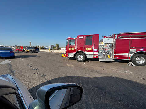 Firemen attending road traffic accident on US freeway