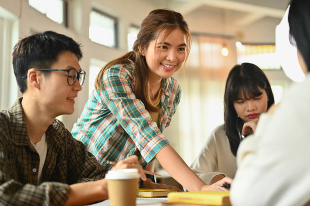 istock Nice, friendly female content creator planning new project with colleagues in creative coworking office 1753755882