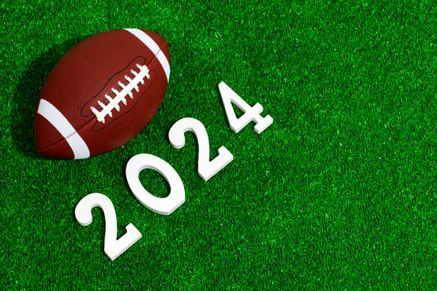 american football ball next to 2024 number - new years party time imagens e fotografias de stock