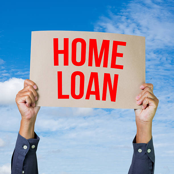 istock Two hands holding brown cardboard with home loan 175376670