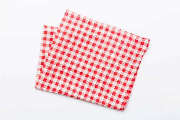 istock top view with red empty kitchen napkin isolated on table background. Folded cloth for mockup with copy space, Flat lay. Minimal style 1753776189
