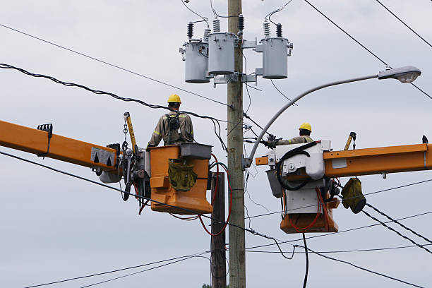 Hydro team at work Hydro men working on a new line blackout photos stock pictures, royalty-free photos & images