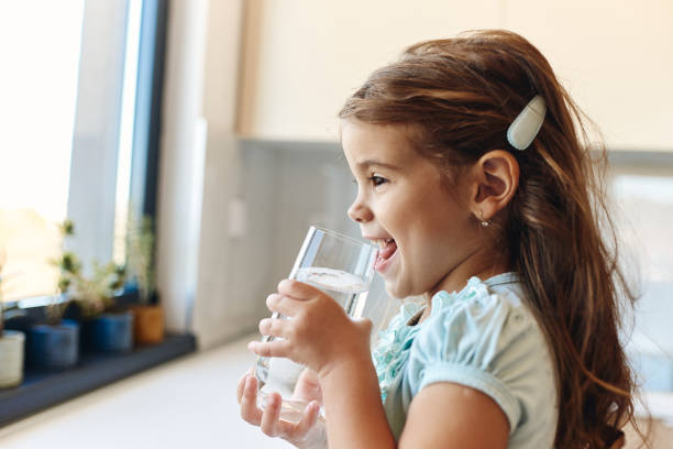 Beautiful girl drinking water stock photo
