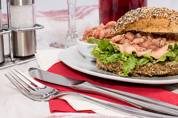 istock Roll with Shrimps on a red striped tablecloth 175378818