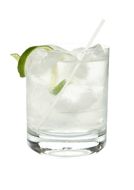 Cocktails on white: Gin and Tonic. A cool gin and tonic to quench your thirst. gin tonic stock pictures, royalty-free photos & images