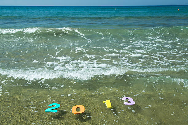 ano 2013 - 2013 beach sand new years day imagens e fotografias de stock
