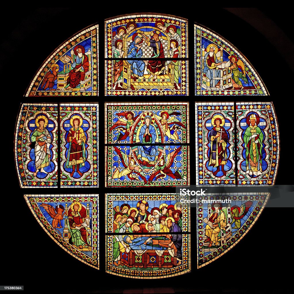 Stained Glass Window at Siena Cathedral "Stained Glass Window ( diameter: 700 cm) at Siena Cathedral, Siena, Italy. Designed by Duccio and Cimbaue. Showing the Death, Assumption and Coronation of the Virgin. c.1287-88. This is the oldest and the most important surviving example of Italian stained glass." Stained Glass Stock Photo