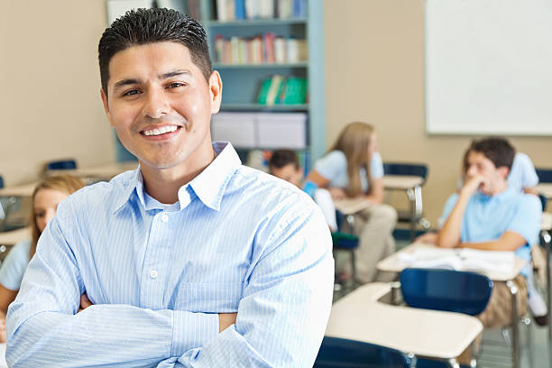 istock Confident teacher in private high school classroom with students 175380547