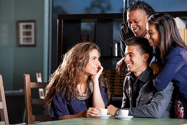 istock College students hanging out in coffee shop 175380650